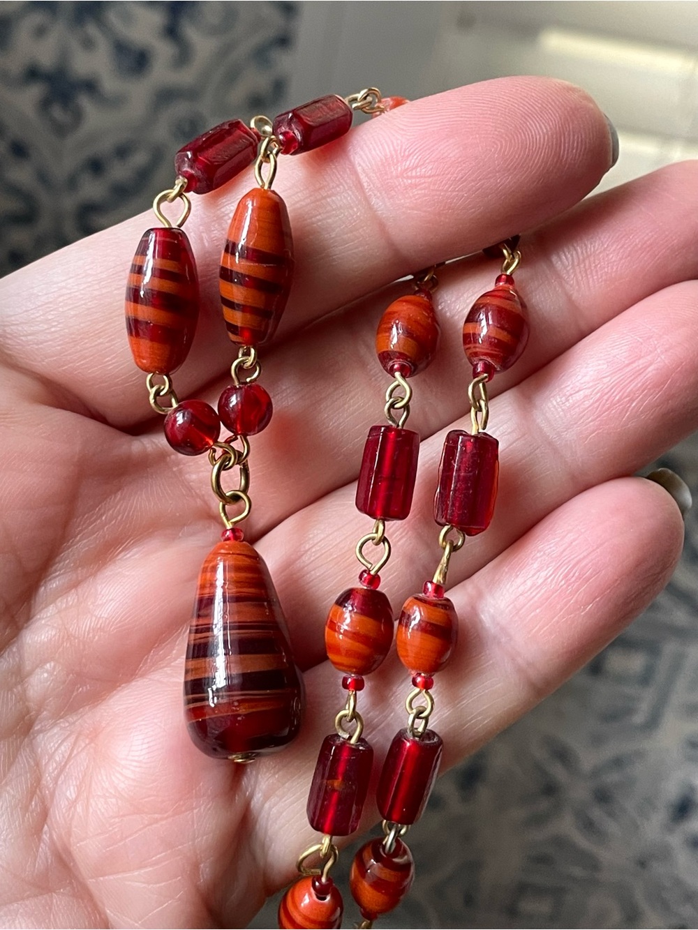 Vintage-style orangey red swirl art glass teardrop necklace Worthington